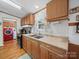 The kitchen has wooden cabinets and stainless steel appliances, plus an attached laundry room for convenience at 130 Benton Rd, Kings Mountain, NC 28086