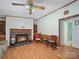 Inviting living room features a cozy fireplace, wood flooring, and a view into the adjacent bathroom at 130 Benton Rd, Kings Mountain, NC 28086