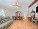 Bright and inviting living room with wood-look flooring, neutral wall paint, and open doorway at 130 Benton Rd, Kings Mountain, NC 28086