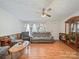Inviting living room showcasing stylish wood-look floors, neutral wall paint, and a ceiling fan at 130 Benton Rd, Kings Mountain, NC 28086