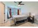 Bedroom with carpet and neutral walls featuring natural light, a ceiling fan and a mirror at 130 Ridge Bluff Rd, Mooresville, NC 28115