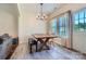 Bright dining area with a rustic wooden table, bench seating, and natural light from a window at 130 Ridge Bluff Rd, Mooresville, NC 28115
