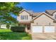 Inviting two-story home with well-maintained lawn, brick accents, and a convenient two-car attached garage at 130 Ridge Bluff Rd, Mooresville, NC 28115