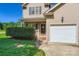 Charming two-story home with a brick entryway, manicured landscaping, and a convenient attached garage at 130 Ridge Bluff Rd, Mooresville, NC 28115