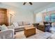 Cozy living room with hardwood floors, an open layout into the dining area, and comfortable furnishings at 130 Ridge Bluff Rd, Mooresville, NC 28115