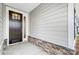 Inviting entrance with a stylish front door, decorative stone accents, and neutral siding at 1425 Ardmore Dr # 247, Sherrills Ford, NC 28673