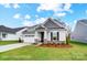Attractive single-story home with a well-maintained lawn, stone details, and inviting entrance at 1425 Ardmore Dr # 247, Sherrills Ford, NC 28673
