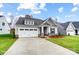 Beautifully designed single-story home with a two-car garage, neat landscaping, and covered entrance at 1425 Ardmore Dr # 247, Sherrills Ford, NC 28673