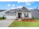 Charming single-story home with a two-car garage, stone accents, and manicured landscaping at 1425 Ardmore Dr # 247, Sherrills Ford, NC 28673