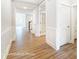 Open foyer with hardwood flooring, fresh white walls, and glimpses of the staircase and living area at 1425 Ardmore Dr # 247, Sherrills Ford, NC 28673