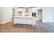 Spacious kitchen featuring a center island, white cabinetry, and sleek hardwood floors at 1425 Ardmore Dr # 247, Sherrills Ford, NC 28673
