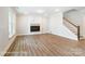 Cozy living room with fireplace, hardwood floors, and large windows at 1425 Ardmore Dr # 247, Sherrills Ford, NC 28673