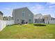 Spacious backyard with privacy fence, lush lawn, and outdoor trampoline at 154 King William Dr, Mooresville, NC 28115