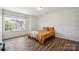 Bedroom featuring hardwood floors, natural light, and modern ceiling fan at 154 King William Dr, Mooresville, NC 28115