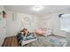Charming bedroom with two teepee beds and playful decor on wood floors at 154 King William Dr, Mooresville, NC 28115