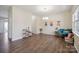 Bright dining area featuring wood floors, natural light, and modern chandelier at 154 King William Dr, Mooresville, NC 28115