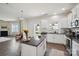 Bright kitchen with stainless steel appliances, granite countertops, and an island with seating at 154 King William Dr, Mooresville, NC 28115