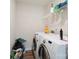 Functional laundry room features modern washer and dryer, plus overhead shelving unit at 154 King William Dr, Mooresville, NC 28115