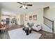 Open concept living room with hardwood floors, staircase, neutral walls, and an inviting atmosphere at 154 King William Dr, Mooresville, NC 28115