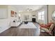 Bright living room with fireplace, hardwood floors, modern furnishings, and abundant natural light at 154 King William Dr, Mooresville, NC 28115
