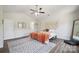 Bright main bedroom with ceiling fan and hardwood floors at 154 King William Dr, Mooresville, NC 28115