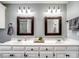 Bright bathroom with double vanity, decorative mirrors, and modern fixtures at 165 Cottontail Se Ln, Concord, NC 28025
