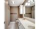 Well-lit bathroom featuring double sinks, white cabinetry, and a neutral color scheme at 165 Cottontail Se Ln, Concord, NC 28025