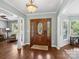 Elegant foyer with hardwood floors, chandelier, and a stained glass front door at 165 Cottontail Se Ln, Concord, NC 28025