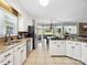 Bright kitchen featuring white cabinetry, granite countertops, stainless steel appliances, and an open layout at 165 Cottontail Se Ln, Concord, NC 28025