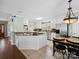 Bright kitchen with stainless steel appliances, a kitchen island and pendant lighting at 165 Cottontail Se Ln, Concord, NC 28025