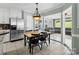 Eat-in kitchen with stainless steel refrigerator and views to living room at 165 Cottontail Se Ln, Concord, NC 28025