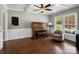 Cozy living room with a piano, coffered ceiling, and large window at 165 Cottontail Se Ln, Concord, NC 28025
