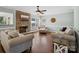 Comfortable living room featuring a stone fireplace and plush seating area at 165 Cottontail Se Ln, Concord, NC 28025