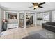 Open living space showcasing tiled floors and seamless transition to dining and kitchen areas at 165 Cottontail Se Ln, Concord, NC 28025