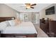 Inviting main bedroom with plush bedding and a glimpse of the ensuite bathroom at 165 Cottontail Se Ln, Concord, NC 28025