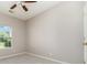 Well-lit bedroom features neutral walls, carpet, a window, and ceiling fan at 168 Devon Forest Dr, Mooresville, NC 28115
