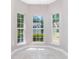 Bright dining area with large windows providing natural light and a view of the yard at 168 Devon Forest Dr, Mooresville, NC 28115