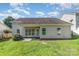 Back exterior featuring a patio and a lush lawn, perfect for outdoor entertaining at 168 Devon Forest Dr, Mooresville, NC 28115