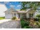 Inviting home featuring manicured landscaping, charming architecture, and an attached single-car garage at 168 Devon Forest Dr, Mooresville, NC 28115