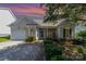 Inviting home featuring manicured landscaping, charming architecture, and an attached single-car garage at 168 Devon Forest Dr, Mooresville, NC 28115