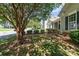 Residential street view featuring a well maintained lawn and beautiful shade tree at 168 Devon Forest Dr, Mooresville, NC 28115