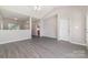 Open floor plan showcases modern flooring, neutral paint, and ample natural light at 168 Devon Forest Dr, Mooresville, NC 28115