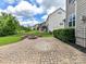 Beautiful backyard with stone paver patio and custom stone fire pit at 17012 Alydar Commons Ln, Charlotte, NC 28278