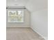 Bedroom featuring a window, plush carpet flooring, and neutral-colored walls at 17012 Alydar Commons Ln, Charlotte, NC 28278