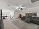 Finished bonus room featuring vintage jukebox, seating, and pool table at 17012 Alydar Commons Ln, Charlotte, NC 28278
