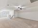 Finished bonus room with neutral carpeting and natural light at 17012 Alydar Commons Ln, Charlotte, NC 28278