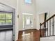 Bright and airy foyer with hardwood floors and a view of the second floor provides a welcoming entrance at 17012 Alydar Commons Ln, Charlotte, NC 28278