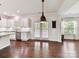 Open-concept kitchen with stainless appliances, and a seamless flow to the dining and living areas at 17012 Alydar Commons Ln, Charlotte, NC 28278