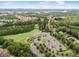 A serene aerial view of the neighborhood surrounded by lush greenery, a golf course, and community clubhouse at 17733 Burnt Hickory Dr, Charlotte, NC 28278