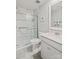 Bathroom featuring a shower with stylish marble-look tile, a large vanity, and modern fixtures at 17733 Burnt Hickory Dr, Charlotte, NC 28278